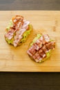 Avocado toast with cherries tomatoes and bacon Royalty Free Stock Photo