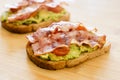 Avocado toast with cherries tomatoes and bacon Royalty Free Stock Photo