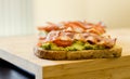 Avocado toast with cherries tomatoes and bacon Royalty Free Stock Photo