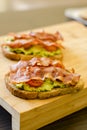 Avocado toast with cherries tomatoes and bacon Royalty Free Stock Photo