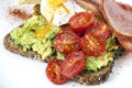 Avocado Toast with Cherry Tomatoes Poached Egg and Bacon Top Vie Royalty Free Stock Photo