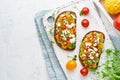 Avocado toast with feta and tomatoes, smorrebrod with ricotta, top view with copy space