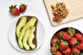 Avocado toast, walnuts and strawberries Royalty Free Stock Photo