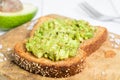 Avocado toast on wholegrain bread on board