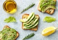 avocado toasts with olive oil, lemon and rosemary. Healthy vegetarian food Royalty Free Stock Photo
