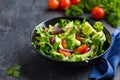 Avocado, tomato and arugula salad. Healthy vegan food.