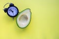 Avocado Wake up with alarm clock Breakfast cheerfulness, healthy Breakfast freshness close-up