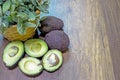 Avocado on a wooden table background. and avocado smoothie in a glass.