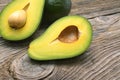 Avocados one cut in two with seed