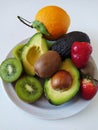 Fresh healthy fruits on a white plate Royalty Free Stock Photo