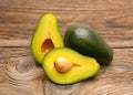 Avocados on a wood table Royalty Free Stock Photo