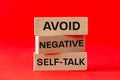 Avoid negative self development symbol, concept text on wooden blocks. Business and avoid negative self development concept