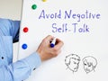 Avoid Negative Self-Talk phrase on the piece of paper