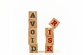 Avoid Risk word written on cube shape. Royalty Free Stock Photo