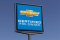 Chevrolet Automobile Dealership with a Certified Pre-Owned sign. Chevy is a Division of General Motors