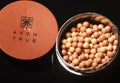 Avon glow bronzing pearls isolated on dark background. Royalty Free Stock Photo