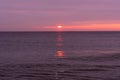 sunrise sky with shore birds and seagulls flying over the Atlantic Ocean near the Shark River Inlet Royalty Free Stock Photo