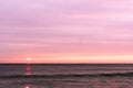 sunrise sky with shore birds and seagulls flying over the Atlantic Ocean near the Shark River Inlet