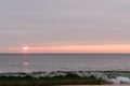 sunrise sky with shore birds and seagulls flying over the Atlantic Ocean near the Shark River Inlet