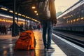 Awaiting the train a traveler with a backpack in the train station