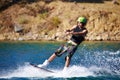 Awake on the wake. Young wakeboarder sliding out on his back foot - copyspace. Royalty Free Stock Photo