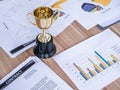 Award trophy on working table with document and contract Royalty Free Stock Photo