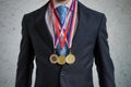 Awarded businessman is wearing many medals