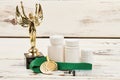 Awards and containers with pills. Royalty Free Stock Photo