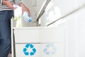 Aware housewife segregating plastic bottles Royalty Free Stock Photo