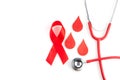 Awareness oncept with blood drop and red ribbon. World Hamophilia day or blood donor day