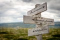 awarness, accomplishments and celebrations text on wooden signpost outdoors in nature. Royalty Free Stock Photo