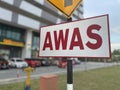 AWAS Warning Sign in Red Letters Royalty Free Stock Photo