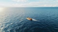 An awe-inspiring aerial shot of a lone fishing boat navigating the vast expanse of the ocean. Royalty Free Stock Photo