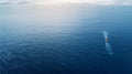 An awe-inspiring aerial shot of a lone fishing boat navigating the vast expanse of the ocean. Royalty Free Stock Photo