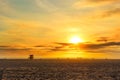 Spectacular Sunset at Venice Beach: Towering Sun and Delighted Beachgoers Royalty Free Stock Photo