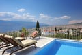 Awe-inspiring Cityscape View from Luxurious Villa with Infinity Pool, Expansive Deck for Sunbathing, Comfortable Lounge Chairs,