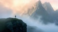 Solitude in Sunrise: Silhouette Against Misty Heights./n Royalty Free Stock Photo