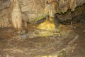 Awe-inspiring scene of a mysterious rocky cave featuring stunning mineral formations