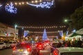 Awe Night scape on Christmas tree, people and town