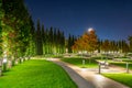 Awe night view on Park `Krasnodar`a with a shallow pond and trees with red leaves