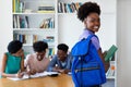 Awesome african american female young adult with students and teacher