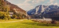 Awesome Alpine Landscape. Austrian Village with Roky Mountain on Background, incredible Autumn Scenery. Amazing Natural View.