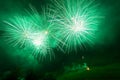 Awesome and brilliant green fireworks above a illuminated church