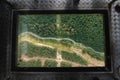 awesome capture of middle glass part of gondola looking down at river and dirt road splitting the landscape