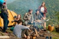 Awesome cheerful hikers holding map, planning their route