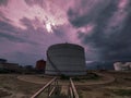 Awesome cloudy sky with a storagetank. Royalty Free Stock Photo
