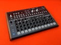 Electronic musical instrument or audio mixer or sound equalizer on a orange background analog modular synthesizer