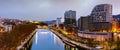 Awesome evening autumn panoramic cityscape view of embankment Estuary of Bilbao. Bilbao, Biscay, Basque country - warm winter in