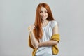 Awesome ginger female model in stylish clothes posing to the camera