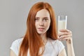 Awesome ginger woman with cold fresh milkshake